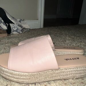 Pink Nude platform sandals.